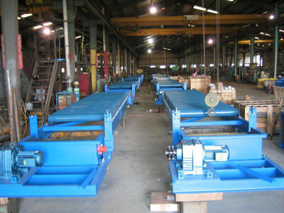 Eight 42” wide front drive belt feeders to be installed under eight 150 ton capacity clay storage silos.