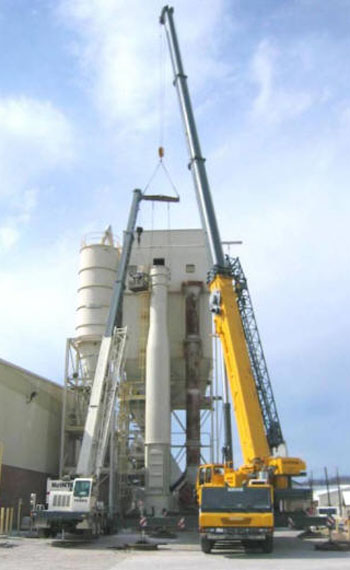 Setting the new replacement base section of a 130' tall freestanding double wall exhaust stack.