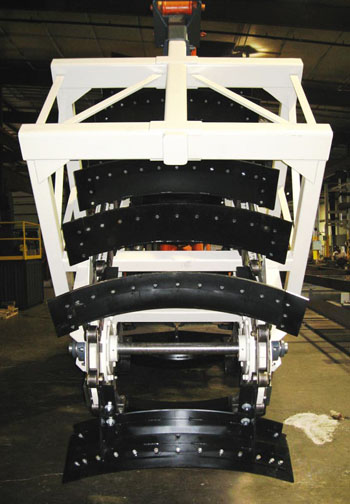 Demonstration reclaimer unit for a large cantilever half portal reclaim system or a bridge reclaim and storage system.