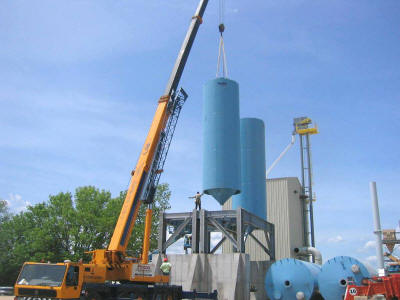 Turnkey silo support structure and four 200 ton capacity frac sand silos in a seismic 3 zone.