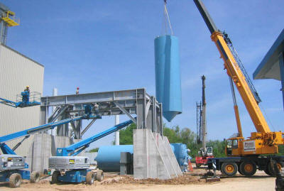 Turnkey silo support structure and four 200 ton capacity frac sand silos in a seismic 3 zone.